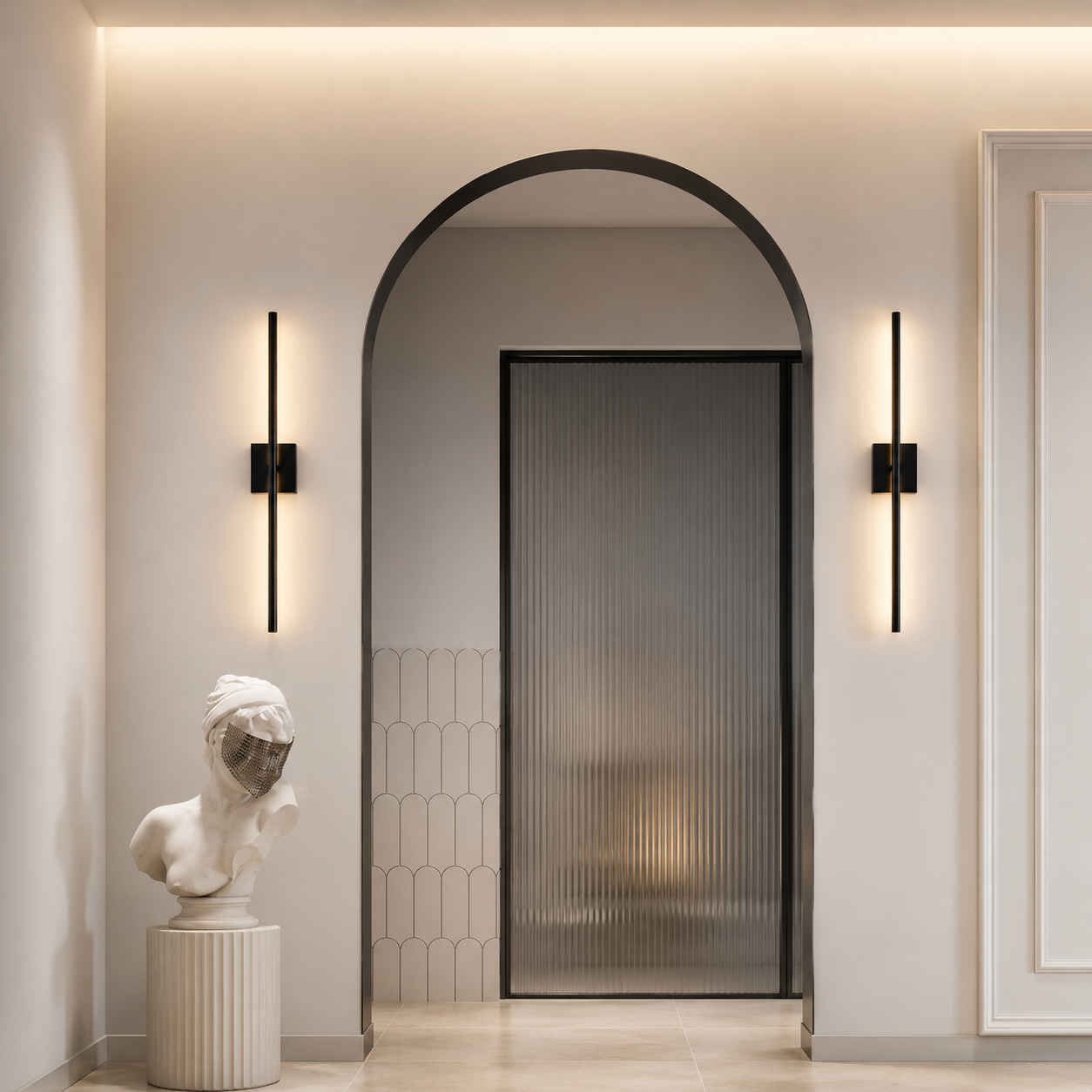 Nordlys Slim Vegglampe mounted on both sides of a luxury arched doorway — warm ambient glow